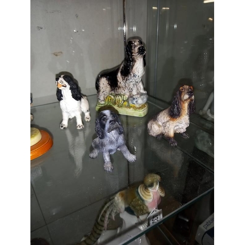 430 - A quantity of Cocker Spaniel dog ornaments. Pottery and resin.