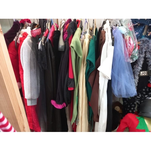 479 - A quantity of fancy dress costumes and a selection of head wear including, Santa, Elf etc. Collect O... 