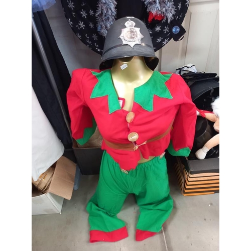 479 - A quantity of fancy dress costumes and a selection of head wear including, Santa, Elf etc. Collect O... 