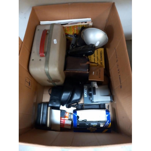 486 - A box of vintage photographic equipment including cameras etc.