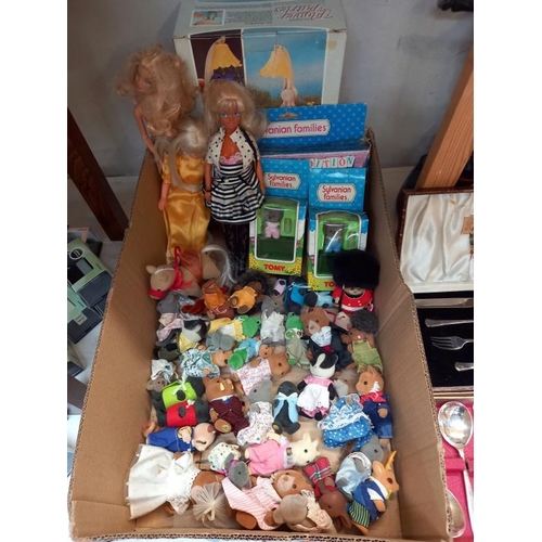 492 - A Vintage Barbie doll and 2 Sindy dolls and a quantity of Sylvanian family figures etc.