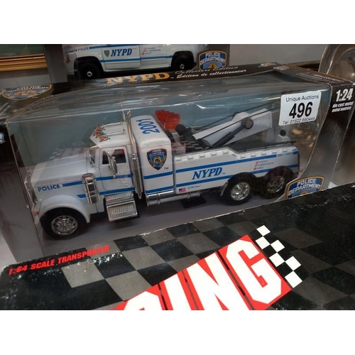 496 - 2 Jada NYPD 1:24 fire engines and 2 American Racing limited edition Diecast models.