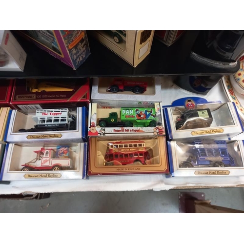 502 - A mixed collection over 3 shelves, of boxed Diecast including Lledo and Matchbox etc. (Some in the w... 