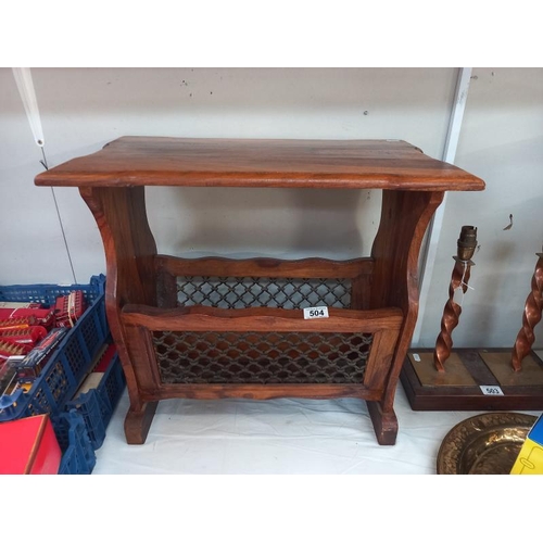 504 - A teak side table/magazine rack with iron front panels. Collect Only.