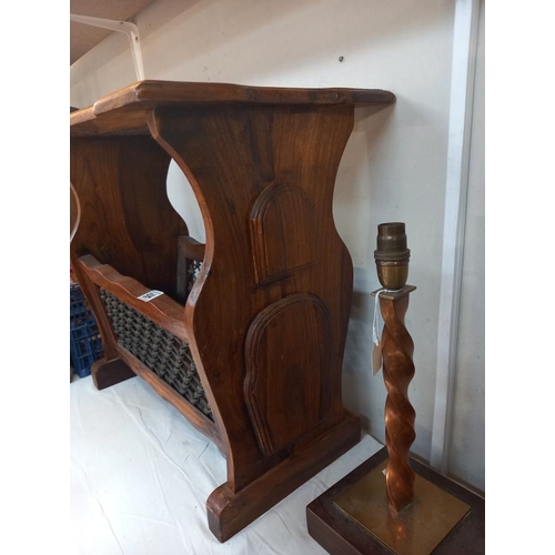 504 - A teak side table/magazine rack with iron front panels. Collect Only.