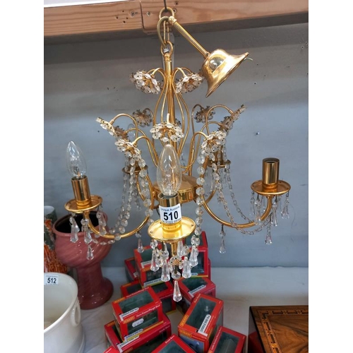 510 - A pair of gilt brass chandeliers with glass droppers, COLLECT ONLY.