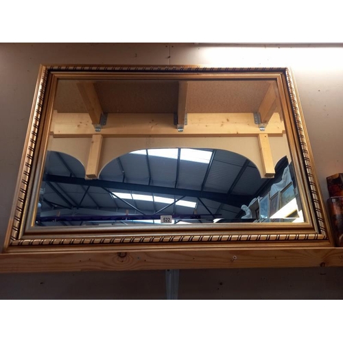 522 - A gilt framed bevel edged mirror. COLLECT ONLY. 108cm x 77cm