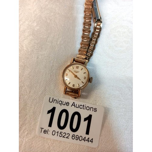 1001 - A Longines 9ct gold cased ladies wrist watch, in working order.