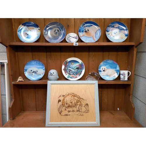 530 - A collection of seal related items including 6 x Franklin mint limited edition porcelain plates, tit... 