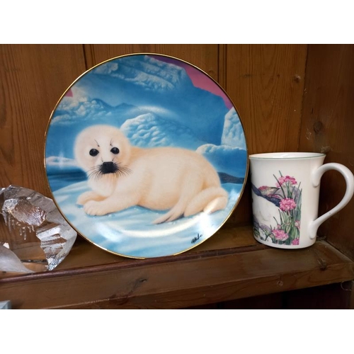 530 - A collection of seal related items including 6 x Franklin mint limited edition porcelain plates, tit... 