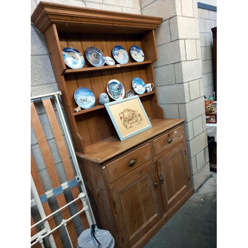 531 - A Victorian pine dresser base, 122cm x 44cm, height 208cm.