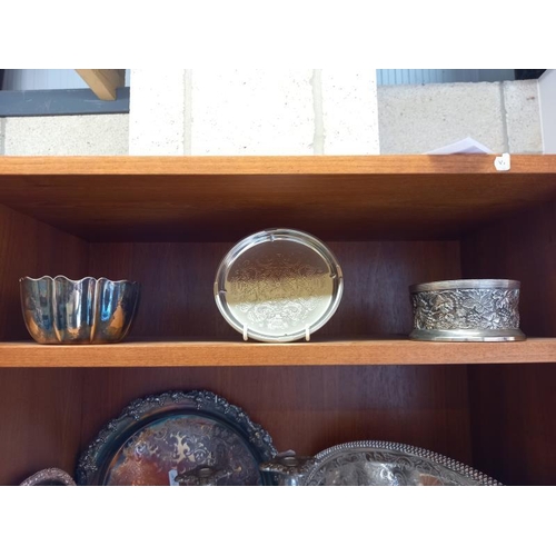 544 - A quantity of silver plate and pewter including candelabra, trays etc. 2 shelves.