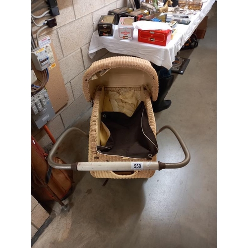 550 - An early 20th century wicker babies pram. Collect Only.