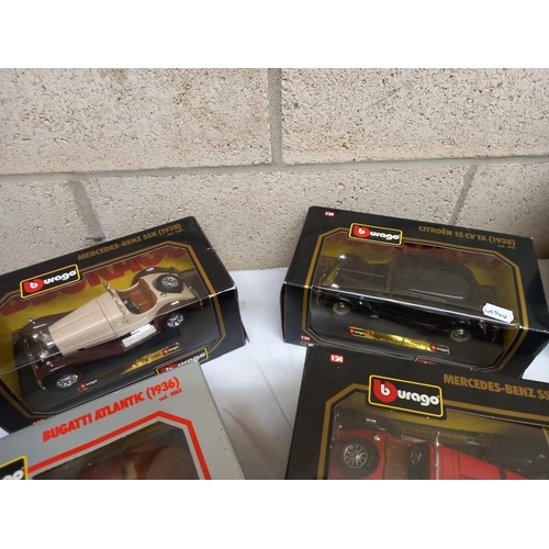 551 - 6 boxed Burago 1:24 scale model cars and 3 others.