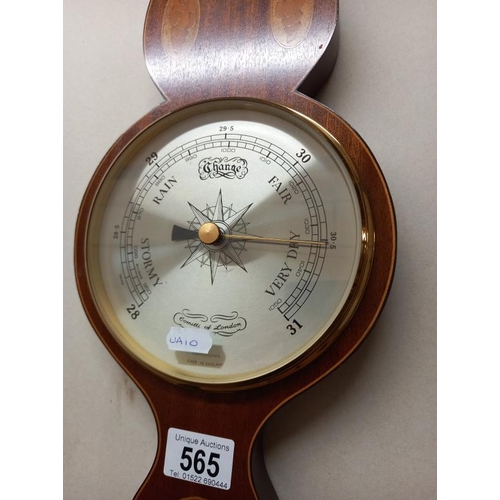 565 - A Comitti of London inlaid aneroid barometer.