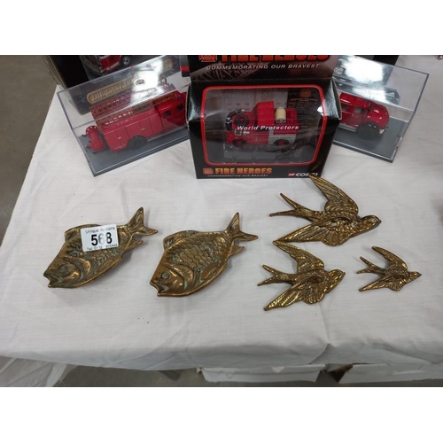 568 - A set of 3 brass graduate bird wall ornaments and 2 fish dishes.