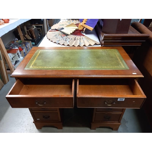 588 - A good mid 20th century walnut pedestal desk with centre door