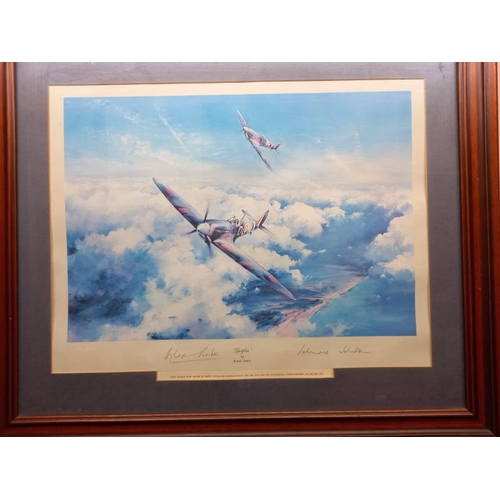 597 - 2 framed, glazed and signed prints of WW2 aircraft one of Spitfire and one limited edition Lancaster... 