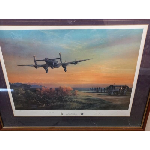 597 - 2 framed, glazed and signed prints of WW2 aircraft one of Spitfire and one limited edition Lancaster... 