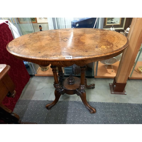 1574 - A small oval mahogany inlaid table with birdcage base. COLLECT ONLY.