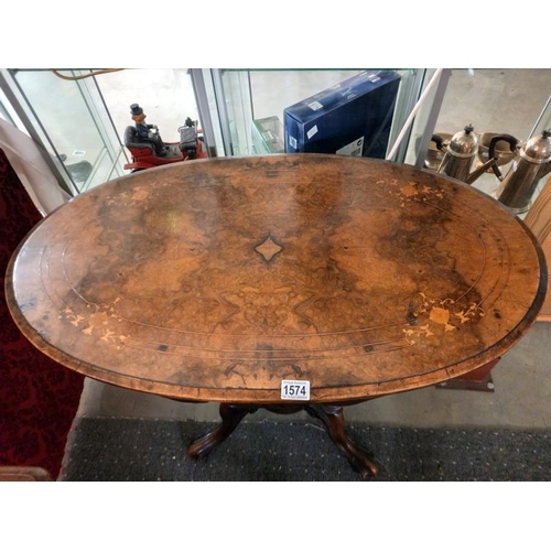 1574 - A small oval mahogany inlaid table with birdcage base. COLLECT ONLY.