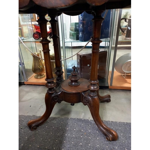 1574 - A small oval mahogany inlaid table with birdcage base. COLLECT ONLY.