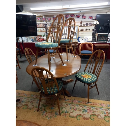 1575 - A good quality Ercol dining table with an extra leaf and six Ercol dining chairs, COLLECT ONLY.