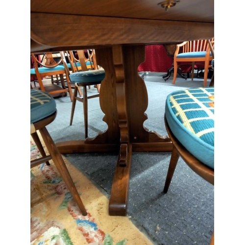 1575 - A good quality Ercol dining table with an extra leaf and six Ercol dining chairs, COLLECT ONLY.