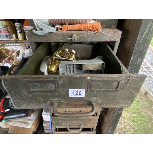 126 - A steel cabinet with drawers, part filled with various ironmongery. Collect Only.