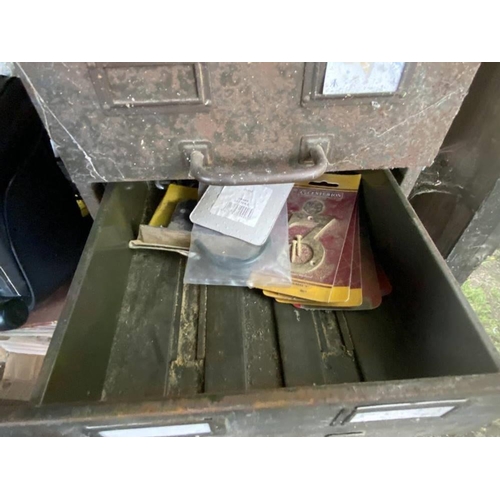 126 - A steel cabinet with drawers, part filled with various ironmongery. Collect Only.