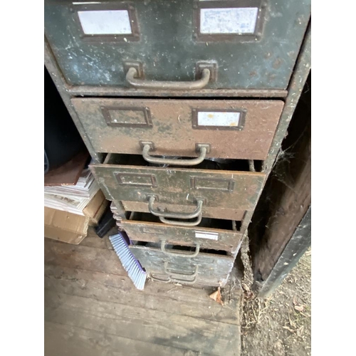 126 - A steel cabinet with drawers, part filled with various ironmongery. Collect Only.