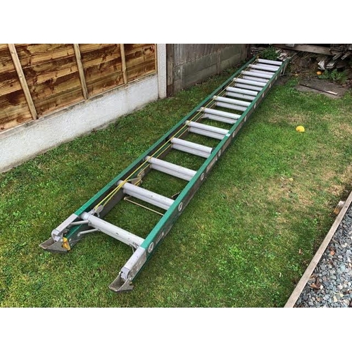 138 - A heavy duty industrial double ladder with fibreglass strings, alloy runs. Collect Only.