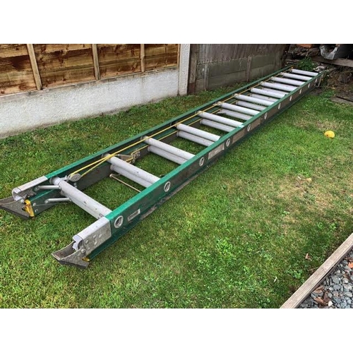 138 - A heavy duty industrial double ladder with fibreglass strings, alloy runs. Collect Only.