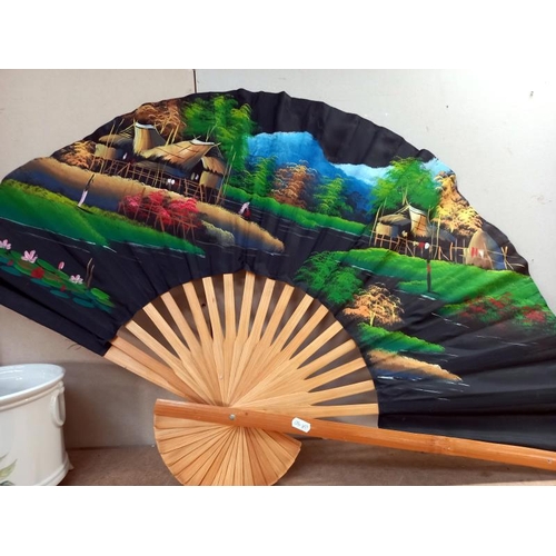 510 - 2 Large hand painted oriental wall fans. 101cm x 61cm.