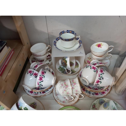 512 - A selection of china cups and saucers.