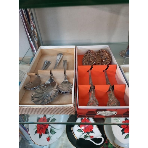 521 - A selection of boxed plated flatware cutlery sets.