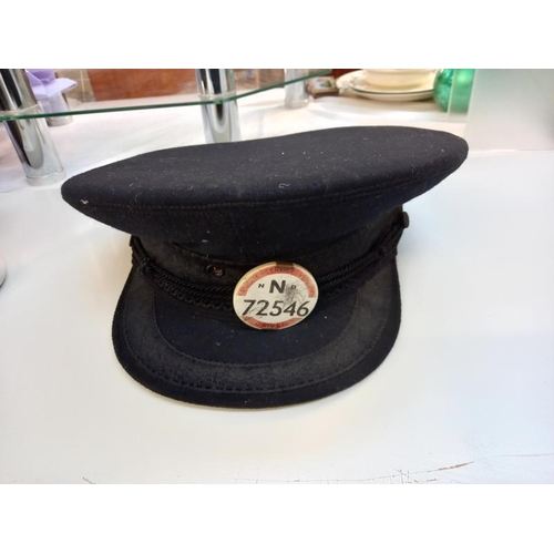 526 - A vintage bus driver cap with badge.