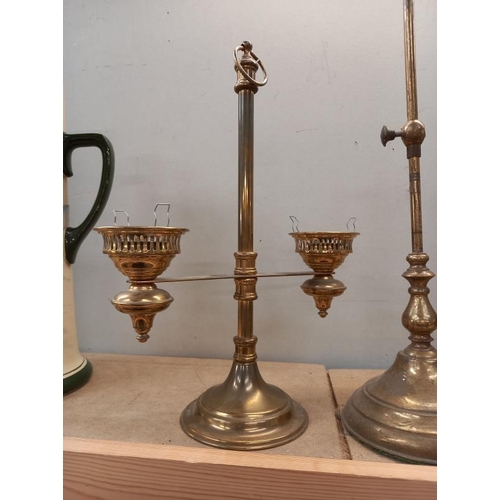 531 - A brass table lamp, candle lamp and one other.