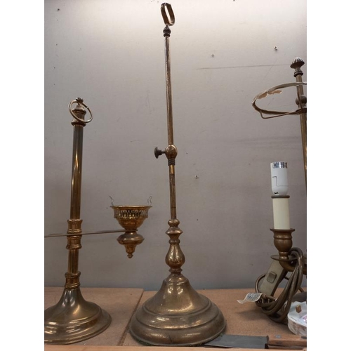 531 - A brass table lamp, candle lamp and one other.