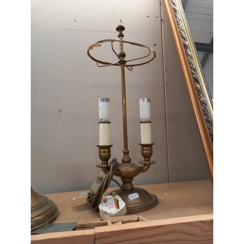 531 - A brass table lamp, candle lamp and one other.