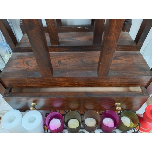 539 - An oak mid 20th century magazine rack with single drawer.