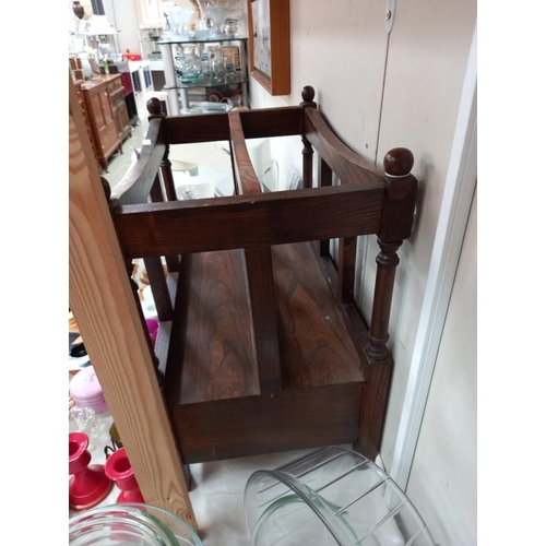 539 - An oak mid 20th century magazine rack with single drawer.