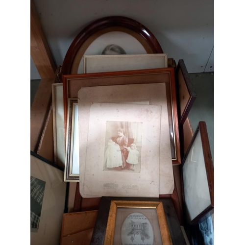 553 - A quantity of frames containing old family photographs.