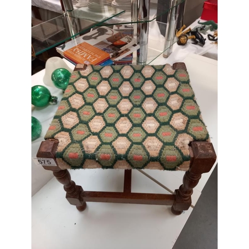 575 - A vintage wicker waste paper bin and oak foot stool with woolwork top.