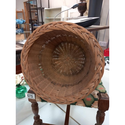 575 - A vintage wicker waste paper bin and oak foot stool with woolwork top.