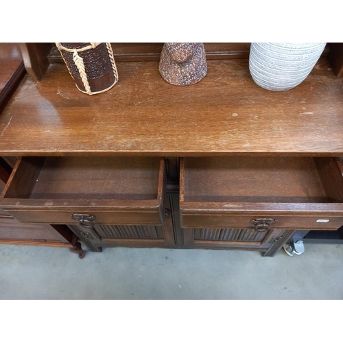 579 - An oak dresser. 2 drawers, 93 cm x 44cm height 82cm. Collect Only.