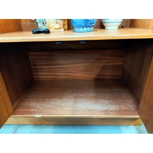 596 - A 1970's teak wall unit. Collect Only.