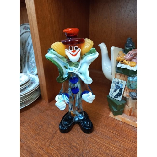 600 - A Murano glass clown, Ringtons blue and white tea caddy, etc.