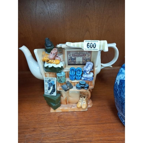 600 - A Murano glass clown, Ringtons blue and white tea caddy, etc.