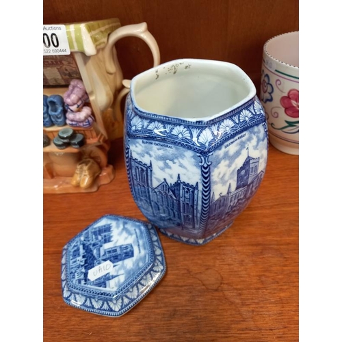 600 - A Murano glass clown, Ringtons blue and white tea caddy, etc.